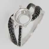 Sterling silver semi mount ring setting with black spinel accent on split shank design, ready for custom gemstone.