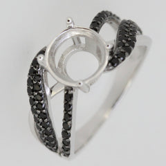 Sterling silver semi mount ring setting with black spinel accent on split shank design, ready for custom gemstone.