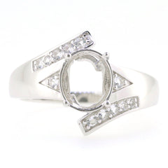 Sterling Silver semi-mount bypass ring setting with White Topaz, designed for an oval 10x8mm gemstone.