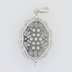 Custom sterling silver semi mount pendant setting with intricate designs and space for gemstones.