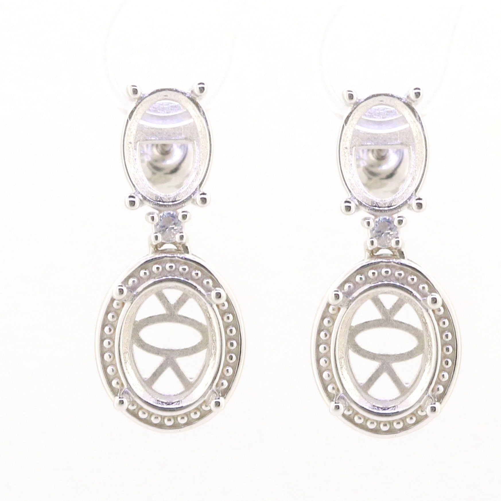 Sterling silver semi mount earrings setting with oval design and white topaz, customizable sizes available.