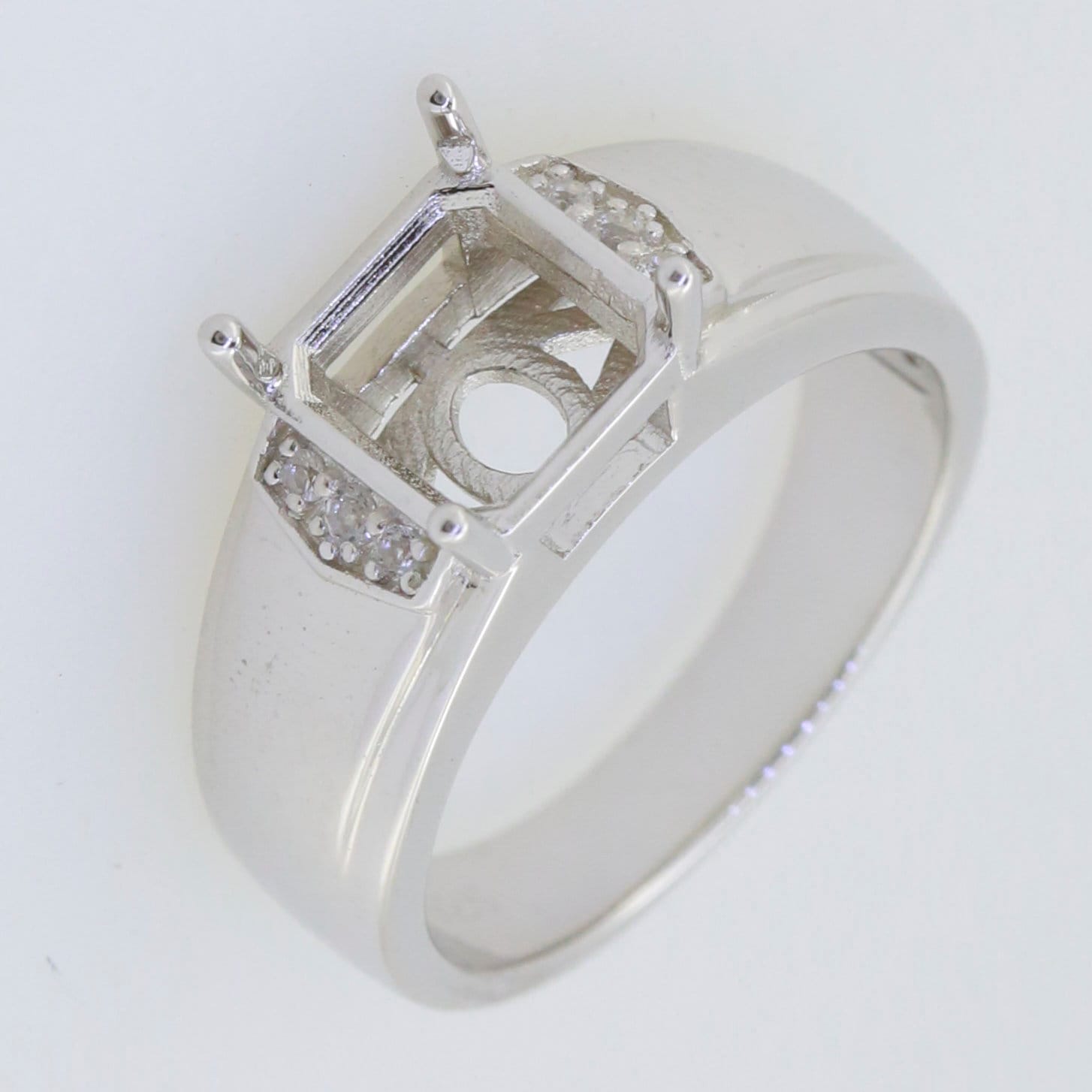 Men's sterling silver semi mount ring setting for square emerald, featuring a sleek design and ornate detailing.