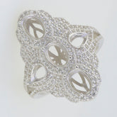 Sterling silver semi mount ring setting with intricate design and multiple stone settings, featuring oval and pear shapes.