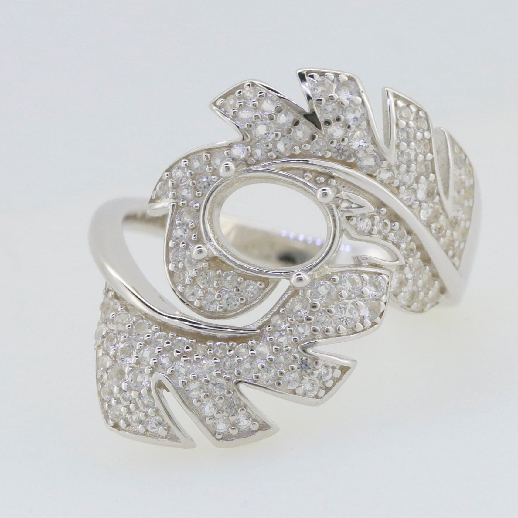 Sterling Silver Semi Mount Ring Setting with leaf design and white topaz accents, oval stone setting for customization.