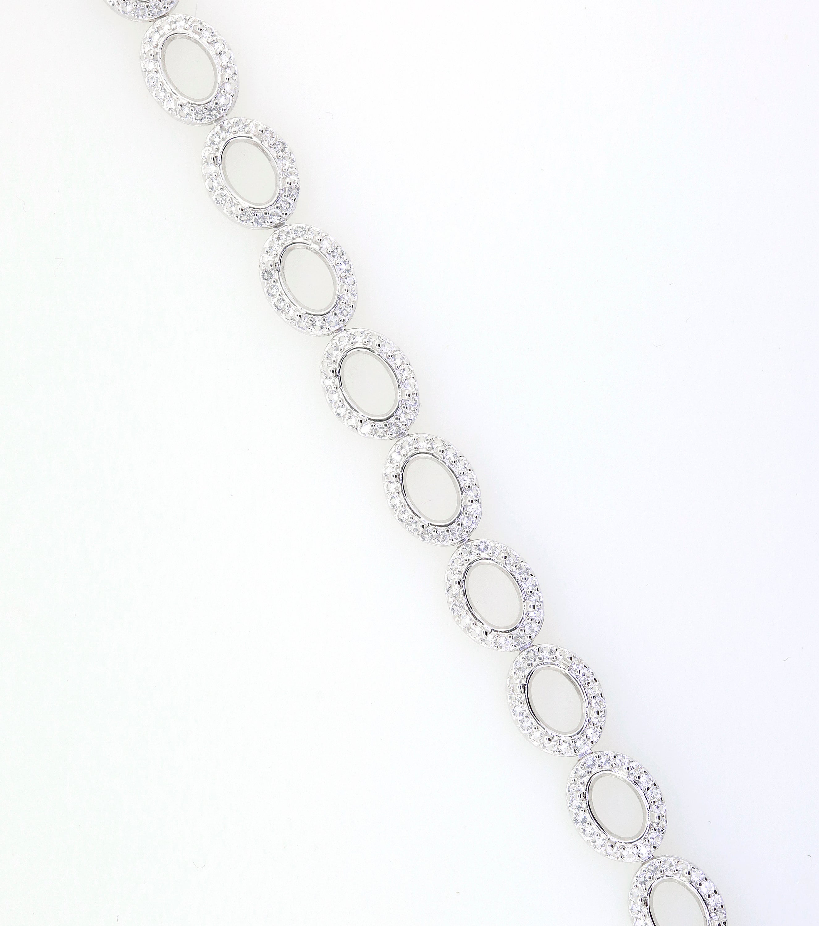 Sterling Silver Semi Mount Tennis Bracelet Setting with Oval Halo and White Topaz illustration, featuring stainless steel tongue.