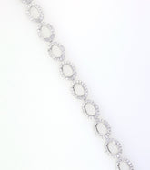 Sterling Silver Semi Mount Tennis Bracelet Setting with Oval Halo and White Topaz illustration, featuring stainless steel tongue.