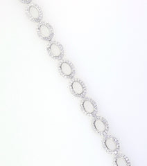 Sterling Silver Semi Mount Tennis Bracelet Setting with Oval Halo and White Topaz illustration, featuring stainless steel tongue.