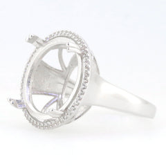 Sterling silver semi mount ring setting with halo design, ready for customization with white topaz side stones.