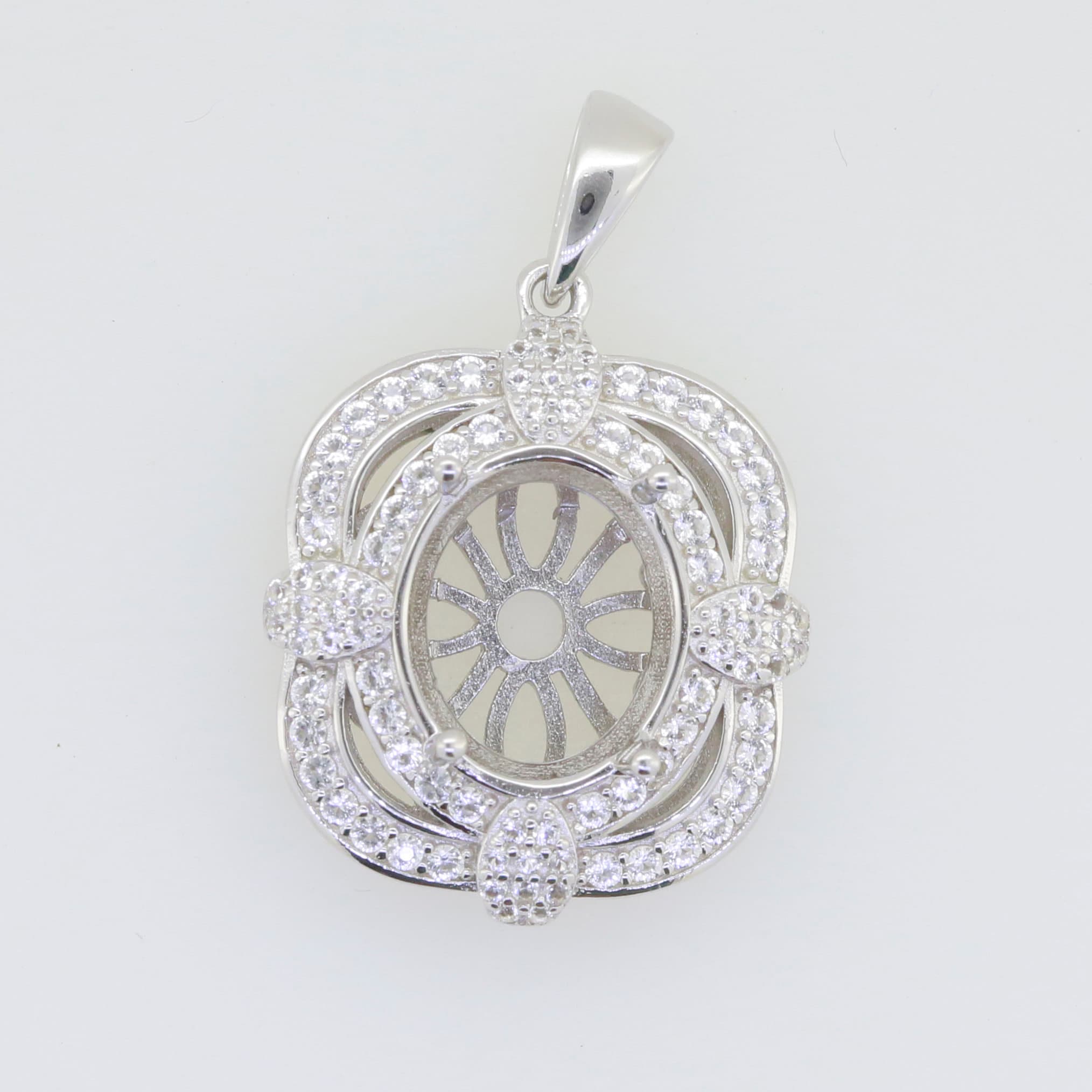 Sterling silver semi mount pendant setting with white topaz halo and oval cavity for gemstone, customizable option.