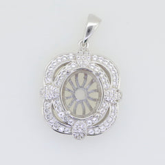 Sterling silver semi mount pendant setting with white topaz halo and oval cavity for gemstone, customizable option.