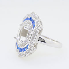 Sterling silver semi mount ring setting with blue corundum and white topaz, designed for an oval gemstone, halo style.