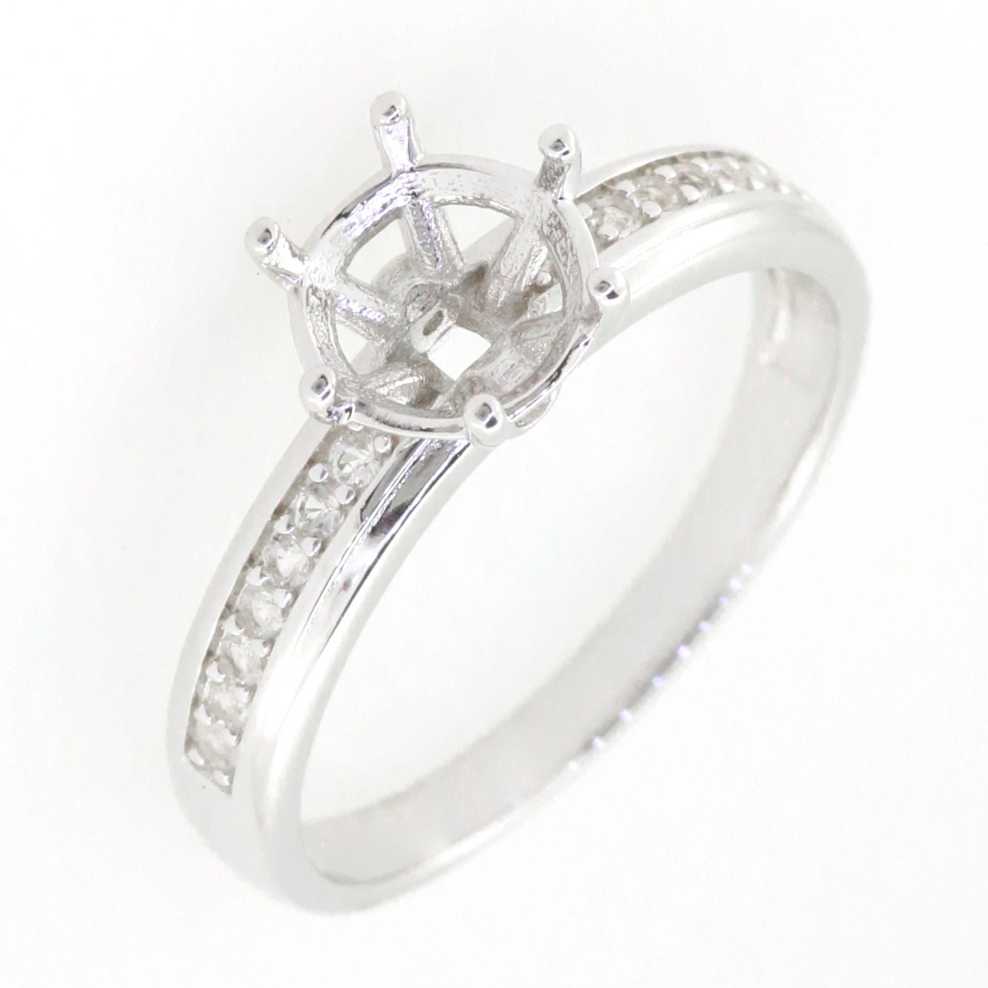 Sterling silver semi mount ring setting with round solitaire design and white topaz accent, made to order.