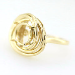 Gold semi mount ring setting with a contemporary infinity loop design for custom gemstones.