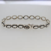 Sterling silver semi mount tennis bracelet setting with black spinel ovals, elegant and durable design.