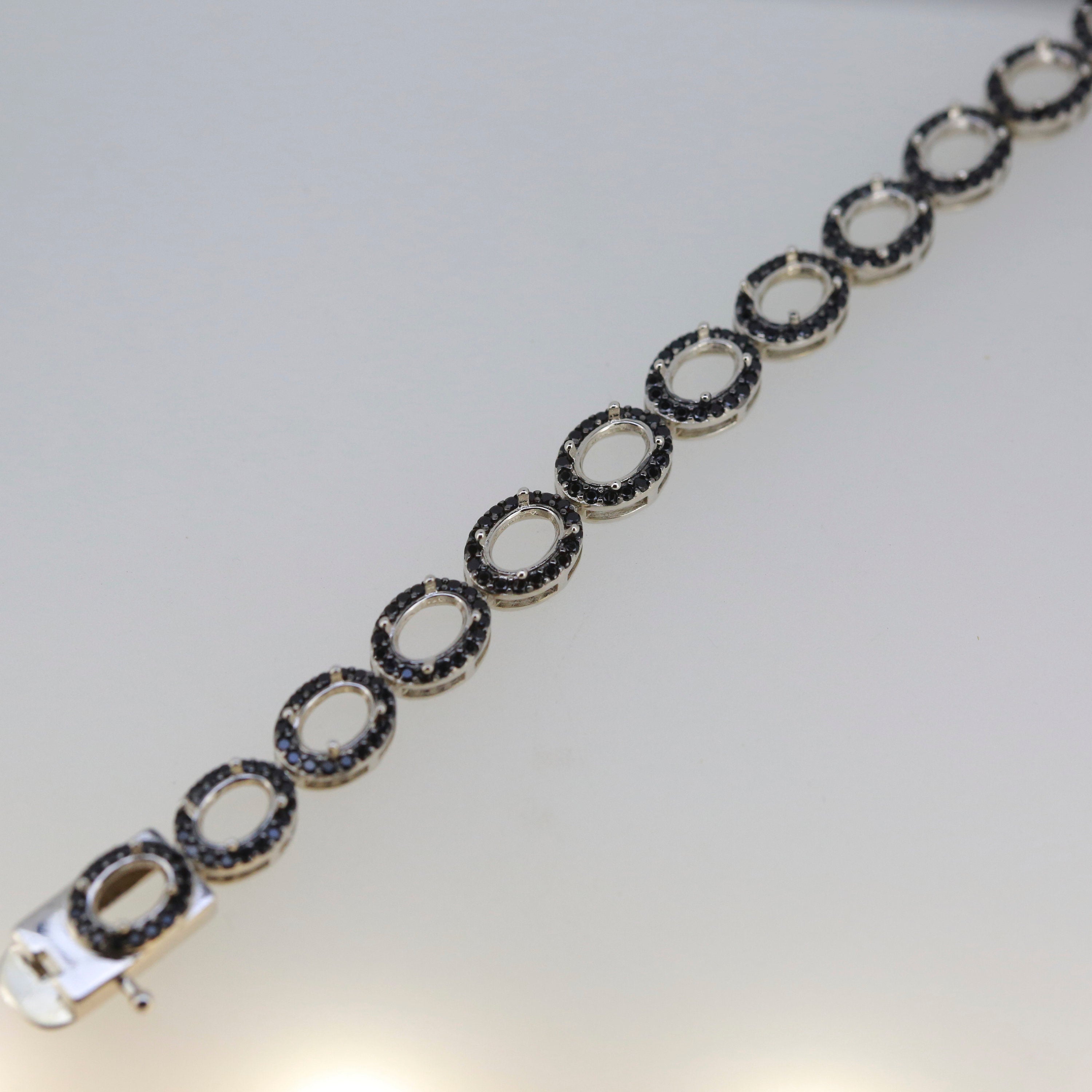 Sterling Silver Semi Mount Tennis Bracelet Setting with Black Spinel and Oval Halo, elegant and customizable design.