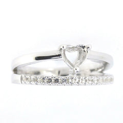 Sterling silver semi mount ring setting featuring a heart design and white topaz accent stones.
