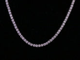 Sterling silver semi mount tennis necklace setting featuring round gemstones, displayed elegantly on a dark background.