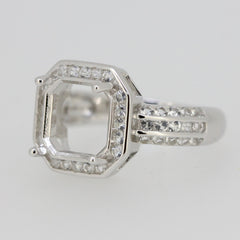 Sterling silver semi mount ring setting with square emerald placeholder and white topaz accents, designed for custom sizes.