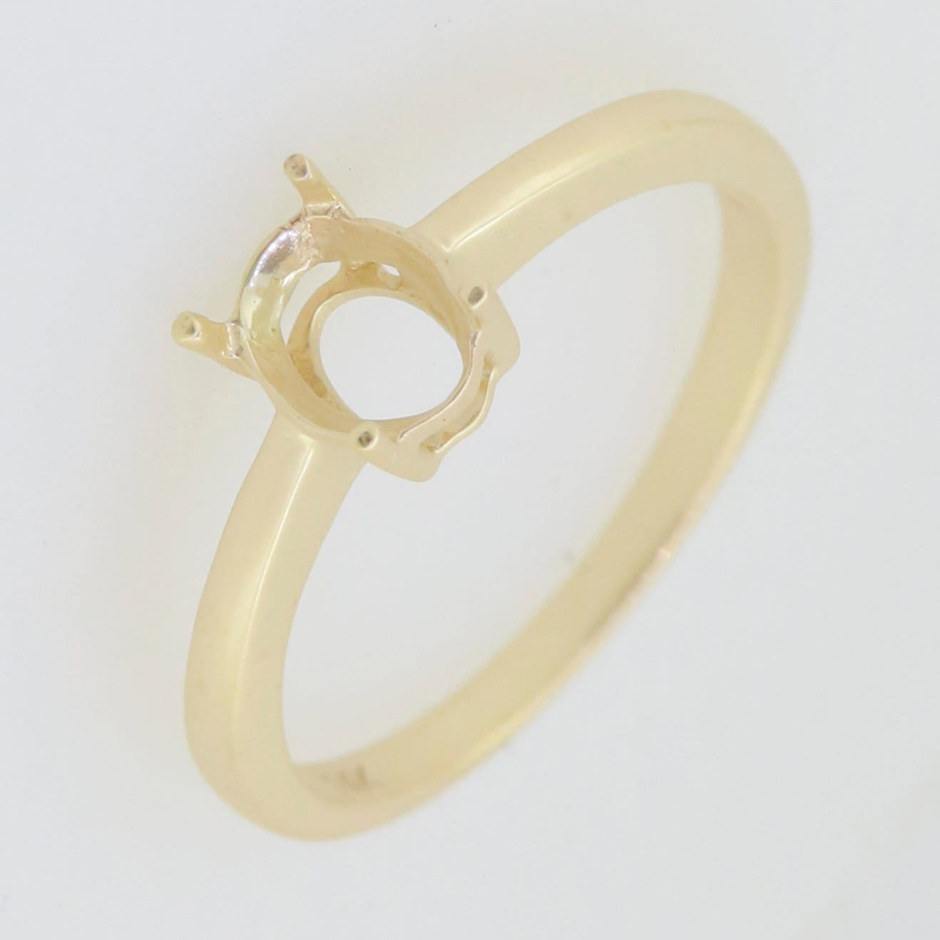 Custom sterling silver semi mount ring setting with an oval stone holder, designed for personalized gems.