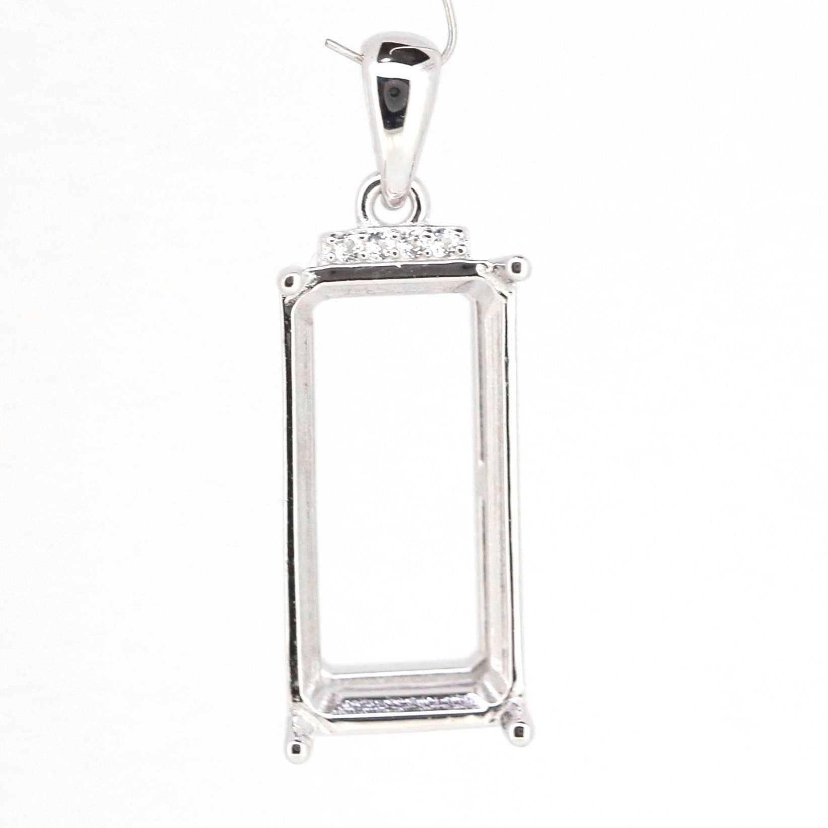 Sterling silver semi mount pendant setting with topaz accent, designed for customizable gemstones.