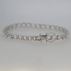 Custom sterling silver semi mount tennis bracelet setting with stainless steel tongue, ready for personalized gemstones.