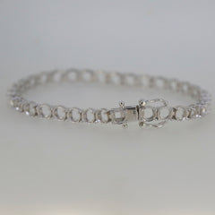 Sterling Silver Semi Mount Tennis Bracelet Setting with stainless steel tongue, designed for customizable gemstone options.