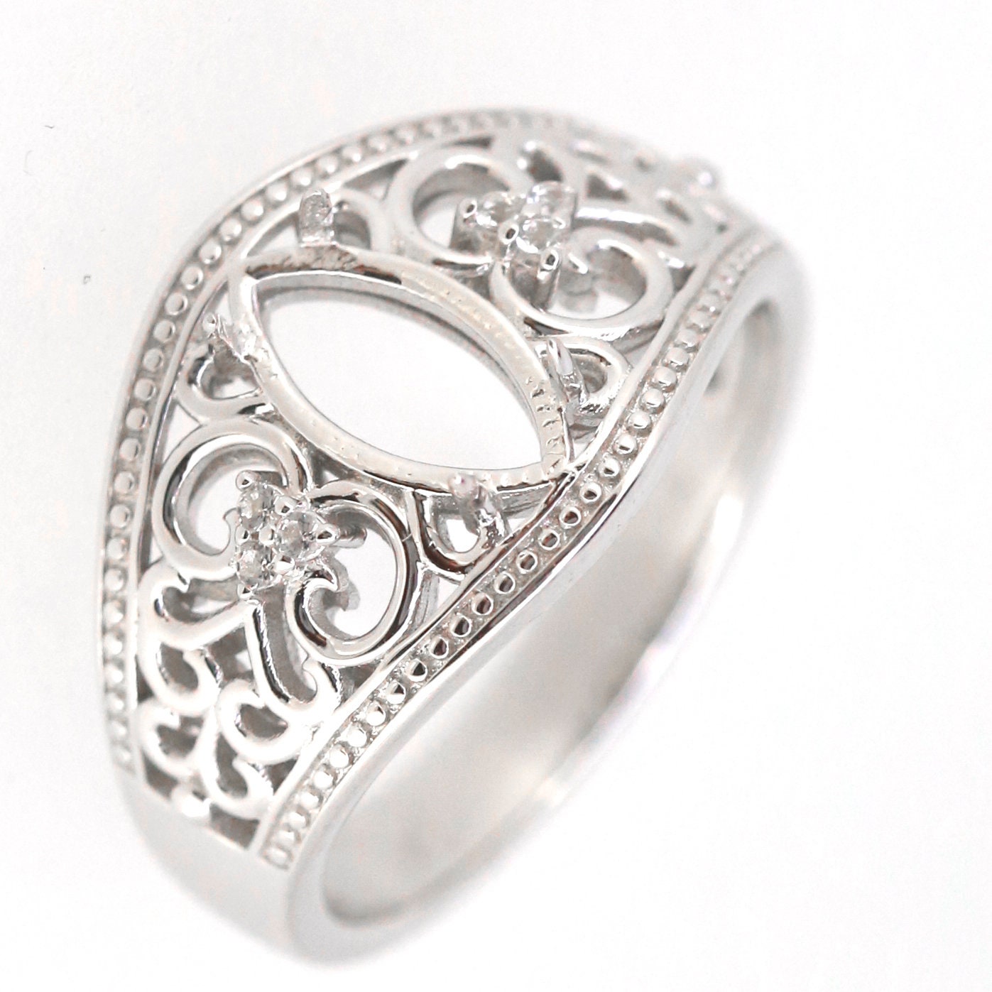 Sterling silver semi mount ring setting with marquise cut design in Art Nouveau style, featuring intricate floral details.