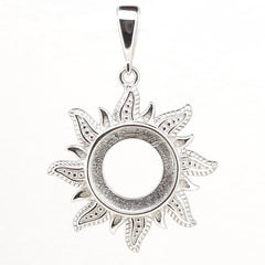 Sterling silver semi mount pendant setting featuring a decorative sun face design, 10x10mm cabochon slot.