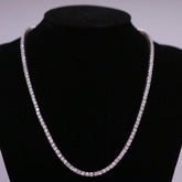 Sterling silver semi mount tennis necklace setting displayed on a black bust, showcasing its brilliance and elegance.