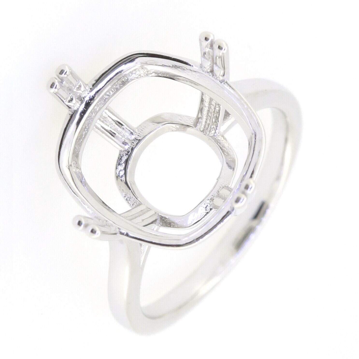 Stylish silver ring setting featuring an intricate open square design, ideal for custom gemstone setups.