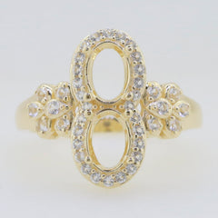 Elegant gold ring with dual oval settings and sparkling stones, perfect for a stylish and unique accessory.