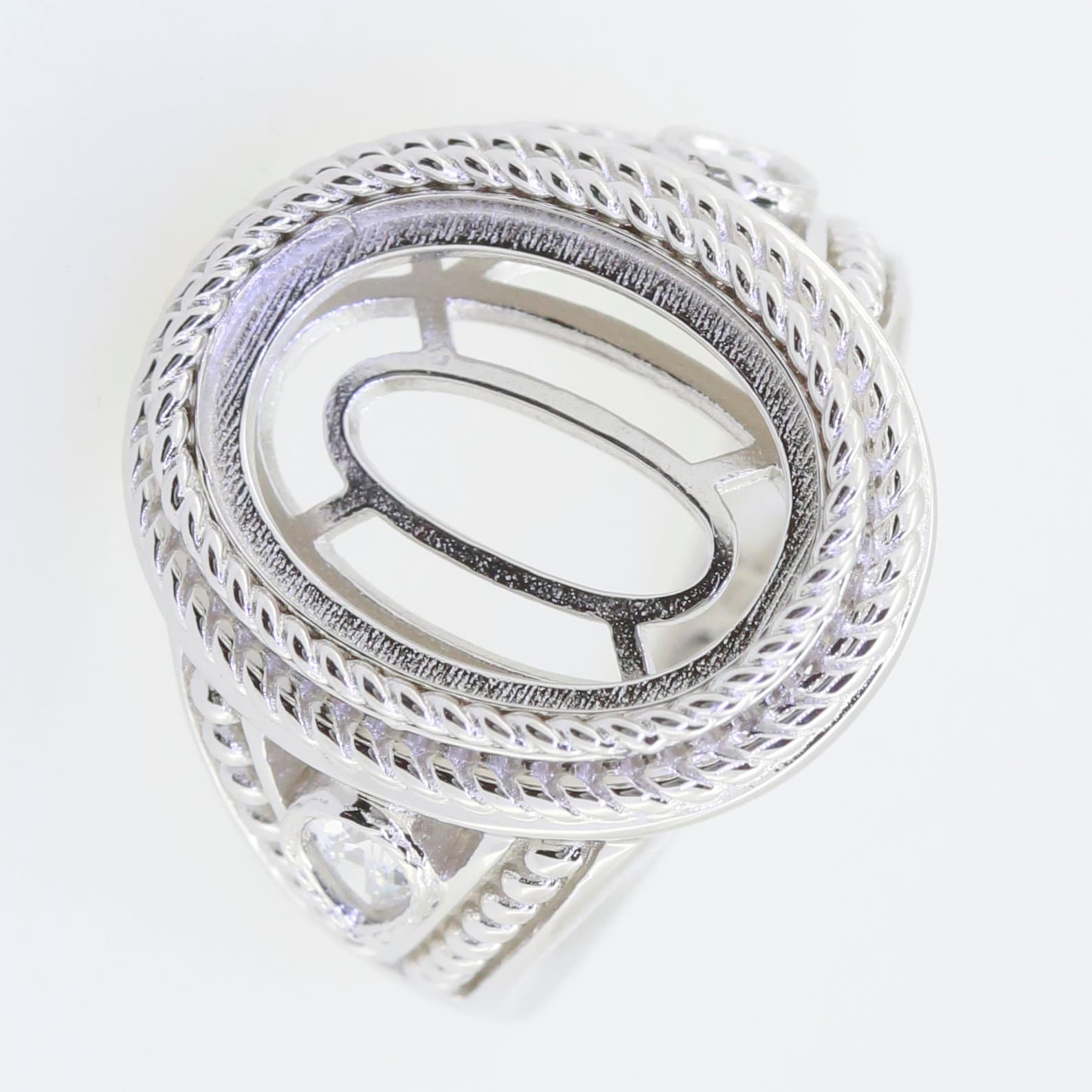 Sterling Silver semi mount ring setting with oval design, ready for custom gemstone fitting.