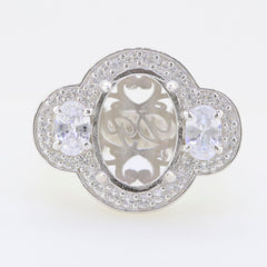 Sterling silver semi mount ring setting for oval gemstone, featuring white topaz accents, ready for custom orders.