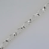 Sterling Silver Semi Mount Tennis Bracelet Setting with oval placeholders for 8x6mm gemstones.