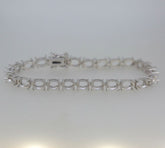 Sterling silver semi mount tennis bracelet setting with oval gemstone placeholders, ideal for custom gemstone designs.