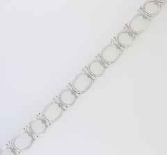 Sterling silver semi mount tennis bracelet setting featuring cushion and round gemstone designs.