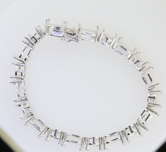 Sterling silver semi mount tennis bracelet setting with stainless steel tongue, designed for customizable gemstone options.