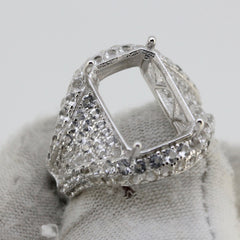 Sterling silver semi mount ring setting with white topaz accents, designed for a 14x10mm emerald gemstone.