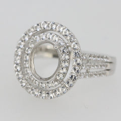 Sterling Silver semi mount ring setting with oval halo and white topaz accents, ideal for customized engagement rings.