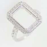 Sterling Silver semi mount ring setting with white topaz accents, designed for an emerald cut gemstone.