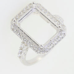 Sterling Silver semi mount ring setting with white topaz accents, designed for an emerald cut gemstone.