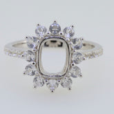 Sterling silver semi mount ring setting featuring an emerald cut halo with D color moissanite accent gemstones.