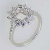 Sterling silver semi mount ring setting with halo of white topaz gems, designed for a 9x7mm cushion center stone.