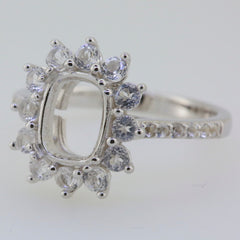 Sterling Silver semi mount ring setting with halo of white topaz accents, designed for a cushion stone of 9x7mm.