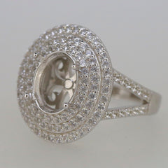 Sterling silver semi mount ring setting with triple halo of white topaz, oval center for custom gemstone placement.