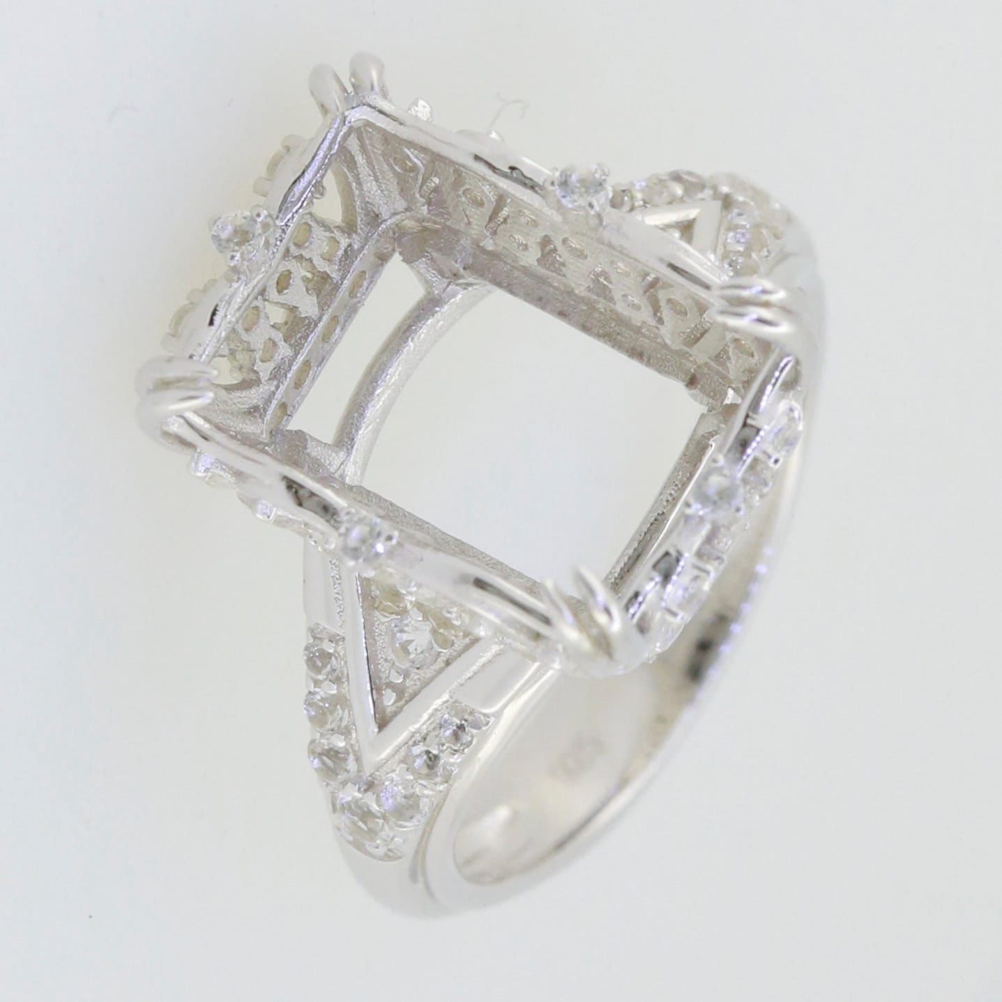 Sterling silver semi mount ring setting with white topaz accents, designed for a 14x10mm main gemstone.