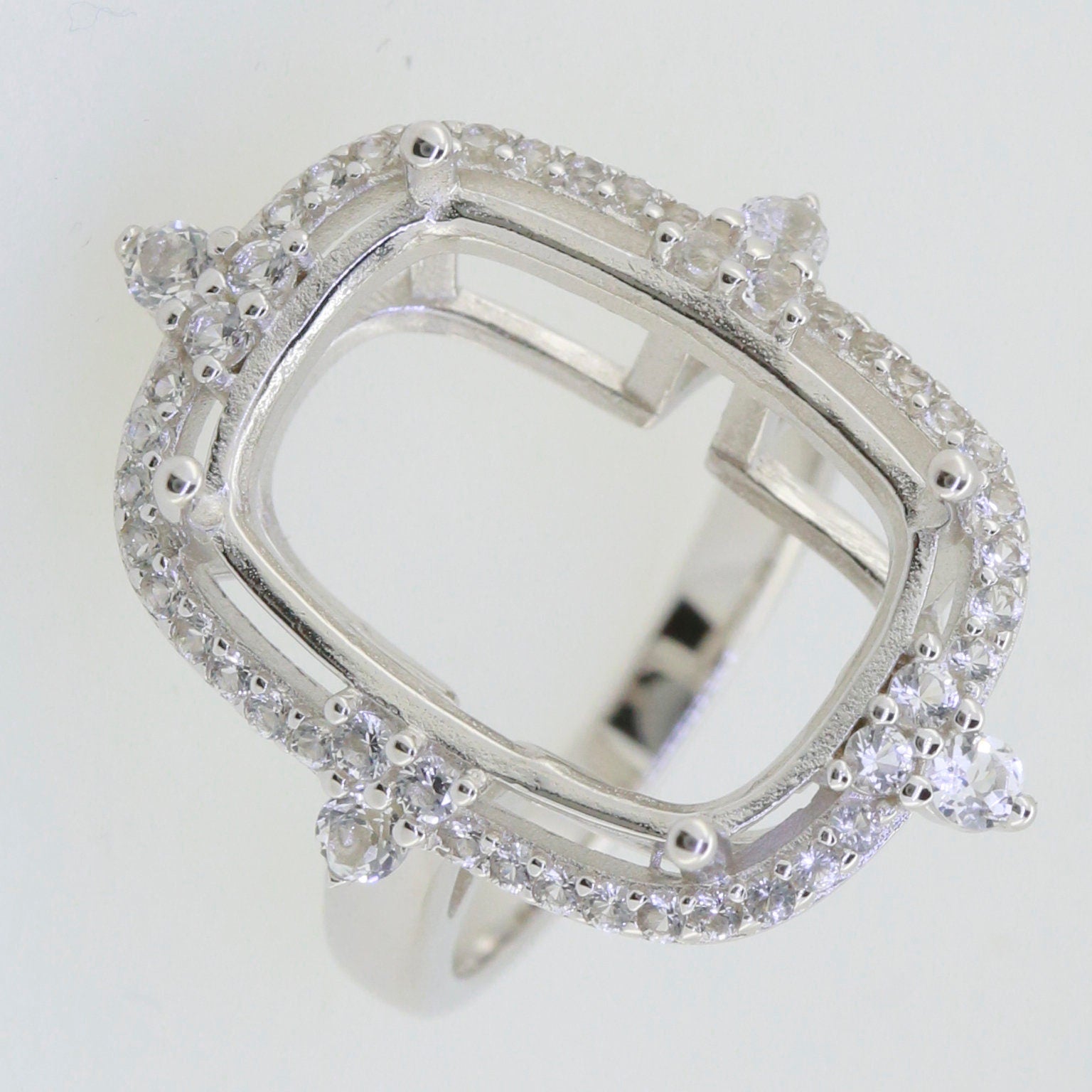 Sterling Silver Semi Mount Ring Setting with White Topaz accents, empty cushion cut for main gemstone, elegant design.