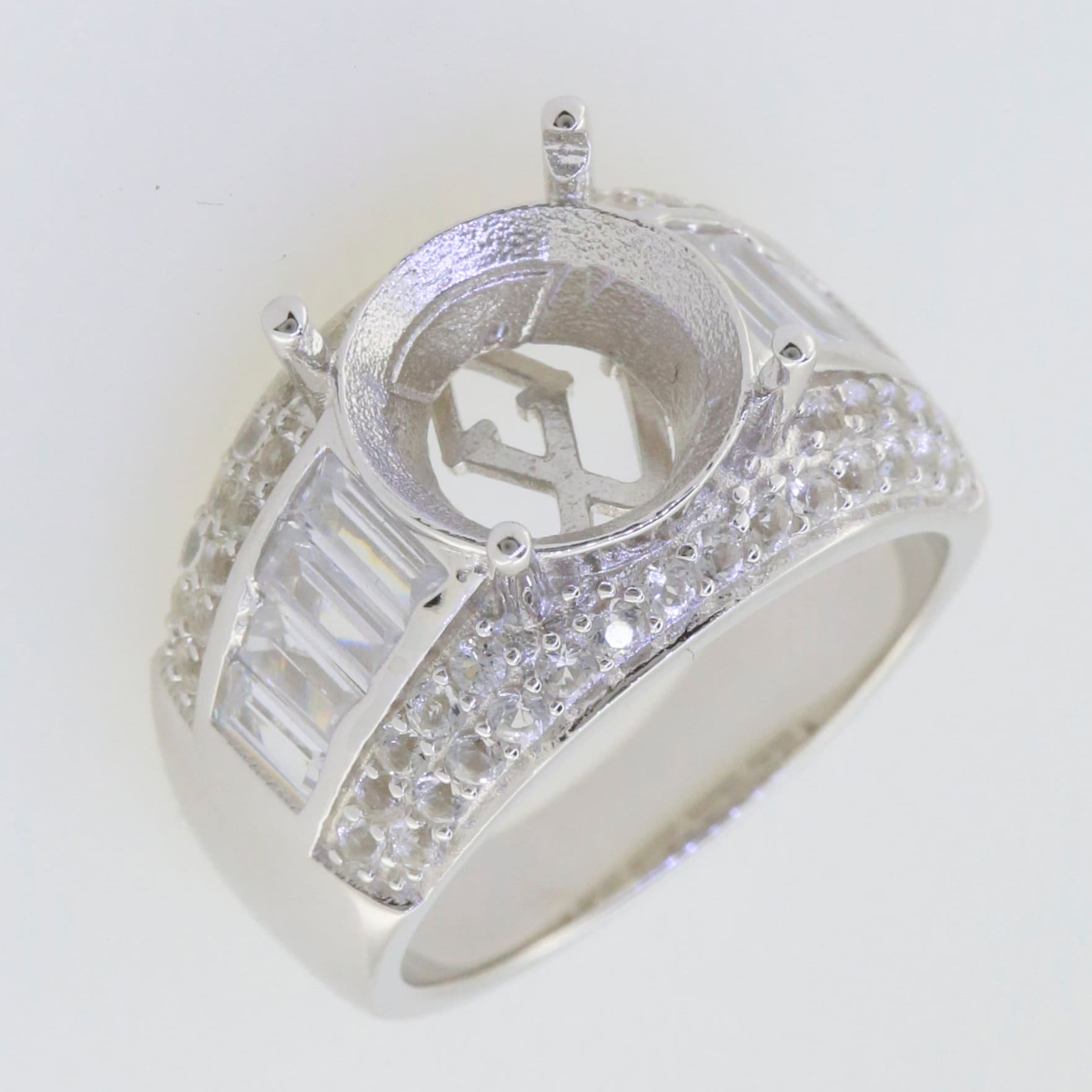 Sterling silver semi mount ring setting with round halo, channel set baguette and white topaz accents.