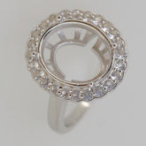 Sterling silver semi mount ring setting with halo and moissanite accents for oval gemstone 14x12mm.