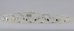 Sterling silver semi mount tennis bracelet setting with oval openings for gemstones, stainless steel tongue for durability.